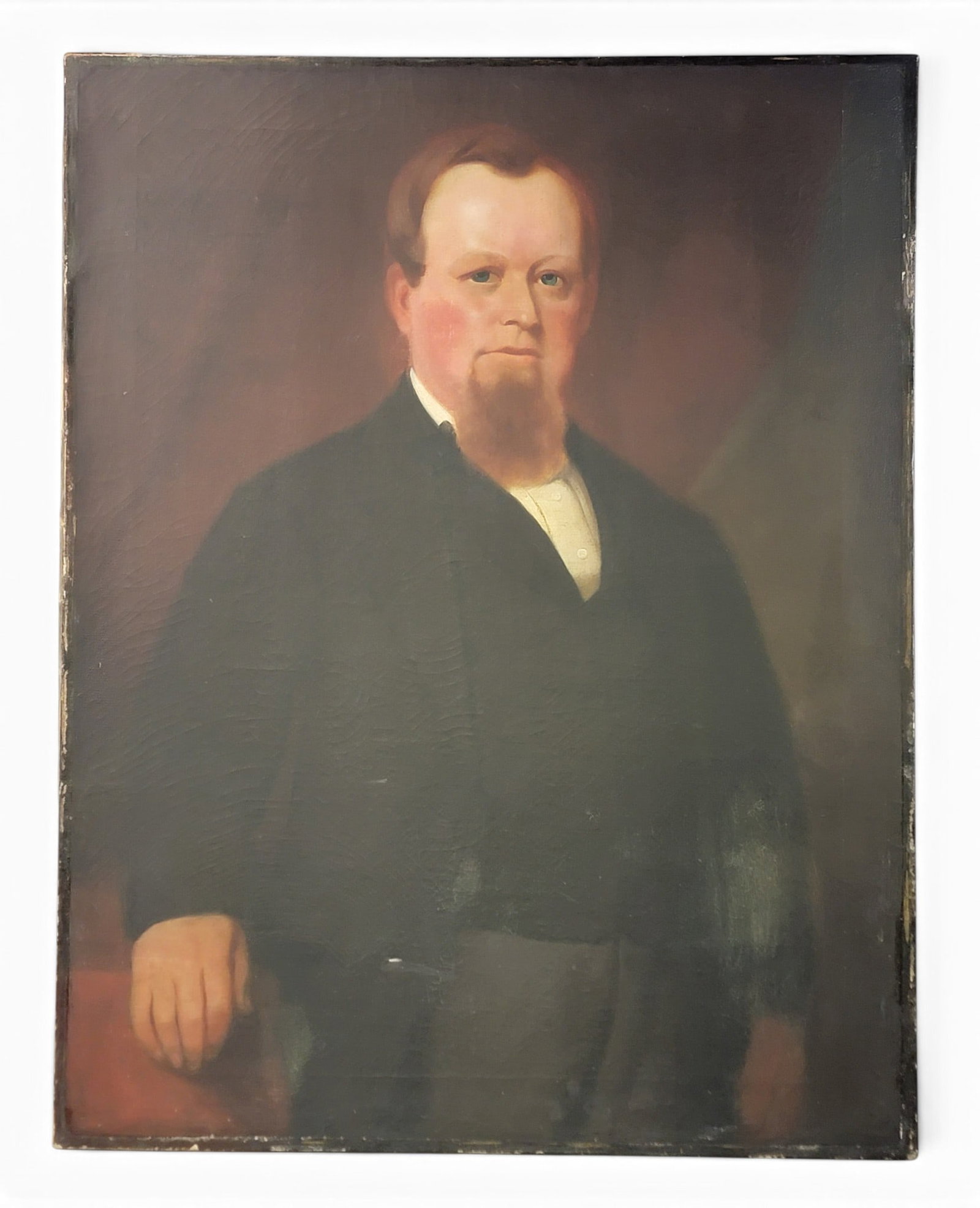 PORTRAIT OF A GENTLEMAN: Probably English, oil on canvas (with London preparer's stencil). Half-length portrait of a bearded man in black. Unframed, 36" by 28". Inscribed on the back is "Born April 30, 1826 / J Jones /