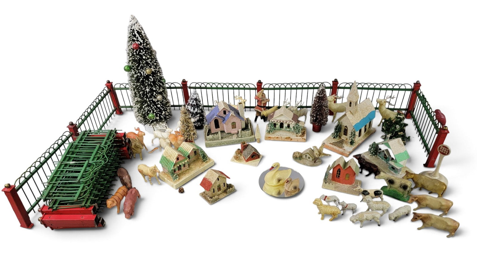 COLLECTION OF VINTAGE CHRISTMAS DECOR: Includes Putz houses, molded plastic animals, trees, and a tree fence. Provenance: a Pennsylvania collection. NOTE: We are happy to answer questions and take additional photos of lots prior to the