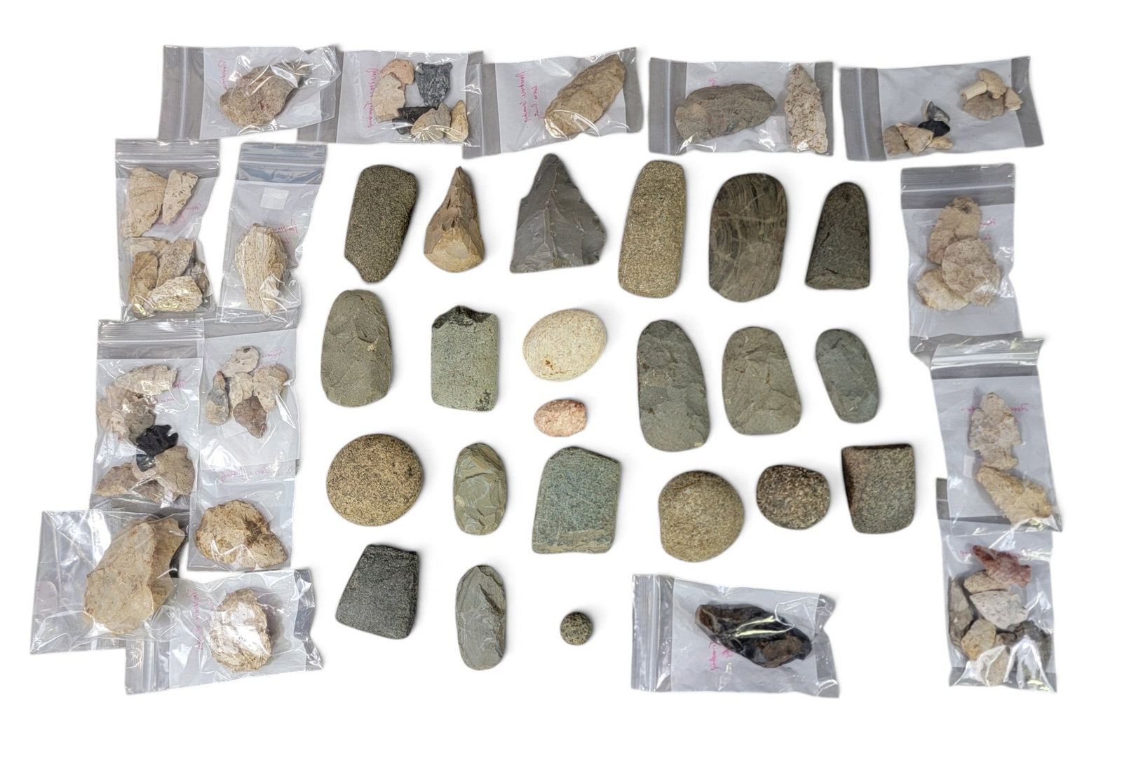 COLLECTION OF OHIO NATIVE AMERICAN ARTIFACTS: All collected 1980s-2000s along the Maumee River, Providence Township, Lucas County. Large collection including ax heads, grinding stones, points, fragments, etc. Provenance: the Collection of Bill