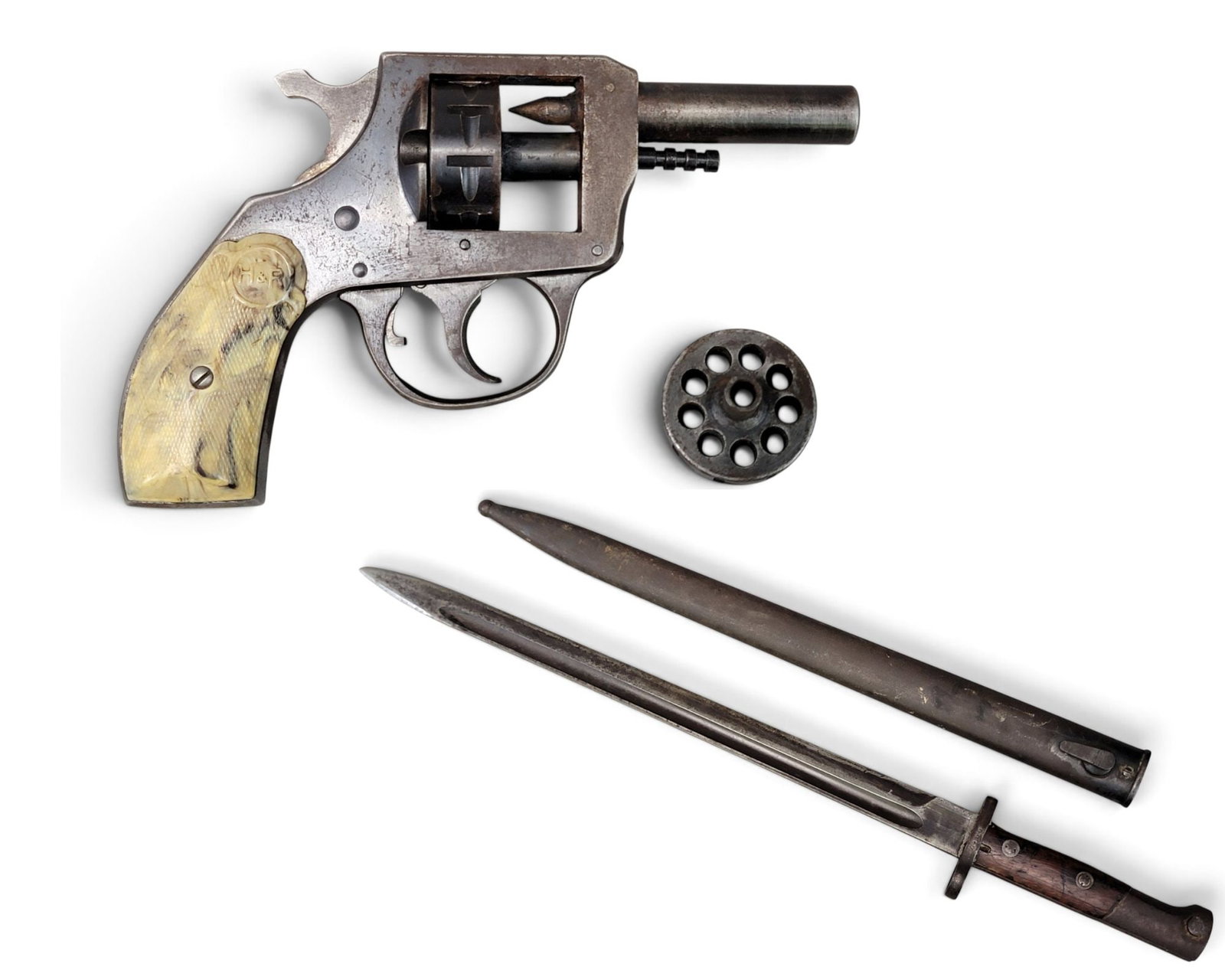 STARTER PISTOL & WWII MAUSER BAYONET: Harrington and Richards Model 970, with marbled grips. S/n 12775. Includes an extra cylinder. Together with an unmarked Mauser bayonet, 15" blade, walnut grips, s/n 7466. The bayonet was captured