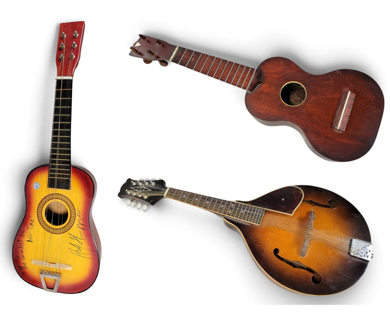 TWO UKULELES AND A MANDOLIN: Alvarez mandolin, A-100, s/n 110294; together with a Sammo uke and an unmarked uke inscribed "The Greatest of All Time" and autographed by an unknown musician. Provenance: a southwest Ohio