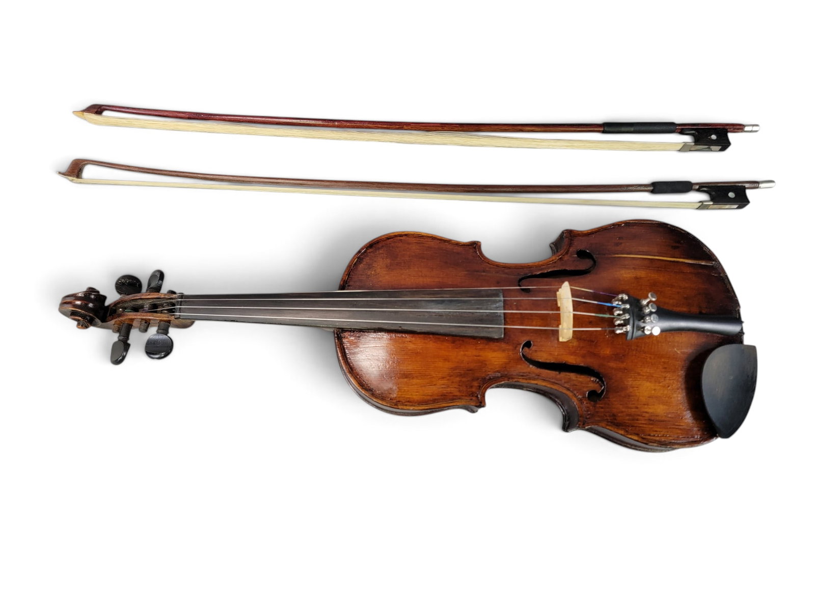 ANTIQUE 3/4 SIZE VIOLIN: Not labeled, probably 19th century. 22.5" long. With modern hardshell case and two bows. Provenance: from a southeast Ohio collection. NOTE: We are happy to answer questions and take additional