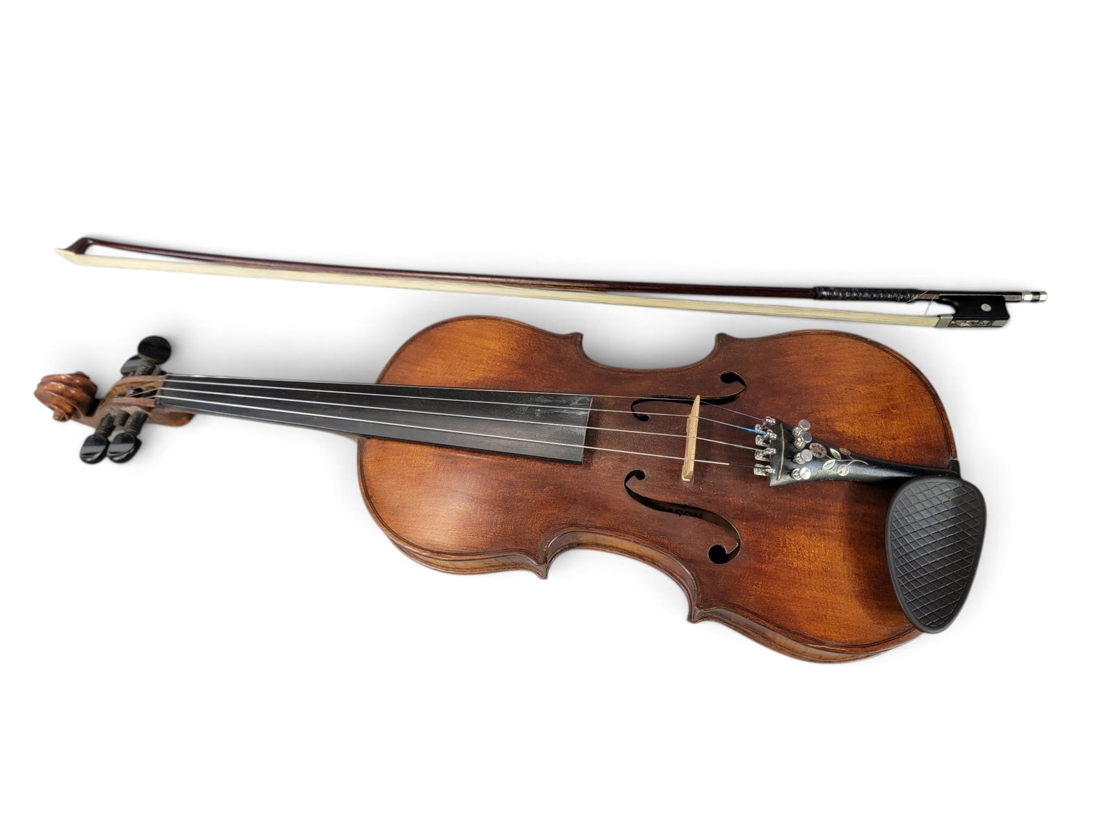 F.A. MASON OHIO VIOLIN: Labeled, Reno, Washington County, 1939. Curly maple, with an inlaid tailpiece. 23.5" long. Includes bow and period hardshell case. Provenance: from a southeast Ohio collection. NOTE: We are happy to