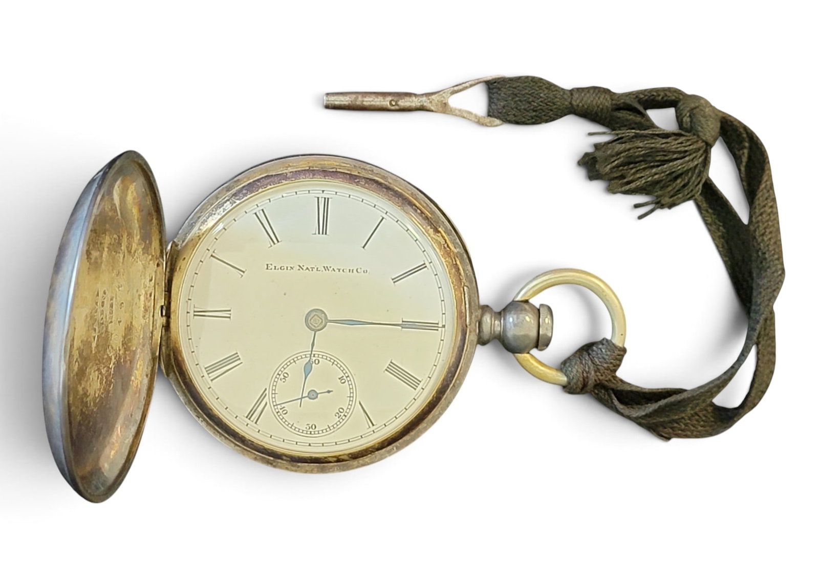 ELGIN POCKET WATCH IN COIN SILVER CASE: Hunter case, keywind, s/n 2557279, in a Fahys coin silver case, s/n U4976. Provenance: the Collection of Bill Williamsen, Grand Rapids, Ohio. NOTE: We are happy to answer questions and take