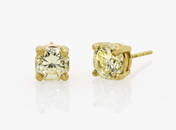 A pair of stud earrings with fancy yellow diamonds in a