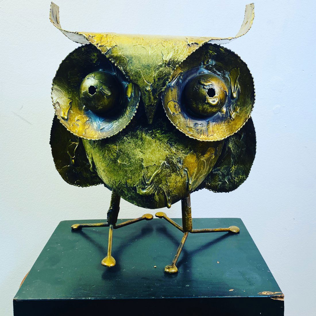 Signed 1962 Monumental Curtis Jere Owl Sculpture: Gold Enameled Metal Brutalist Owl Sculpture By Curtis Jere on A Black Wooden Base.Signed and Dated 1962.Measurements of The Owl Alone are 14 1/2” H x 13” Wide x 7” Deep.Black Lacquered Wood Base