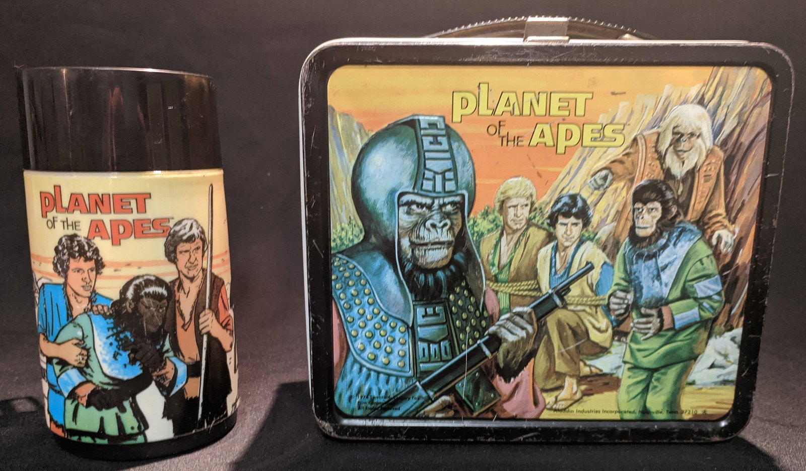 1974 Planet of the Apes LUNCHBOX & Thermo Bottle: Embossed Vintage Metal Lunch Box with images from the classic sci-fi TV series Planet of the Apes starring Roddy McDowell as Galen the chimpanzee friend of lost astronauts Virdon and Burke who are bei