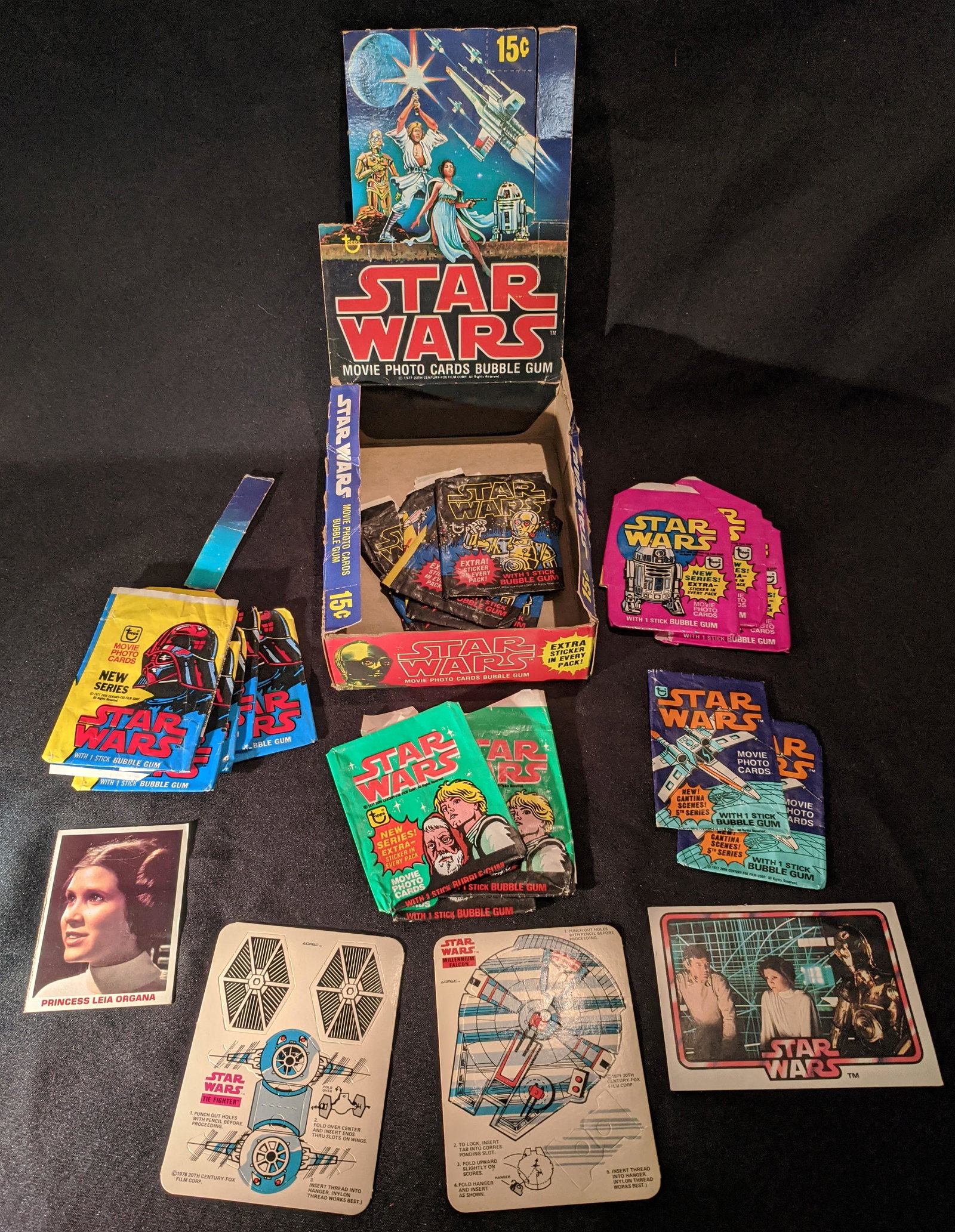 Lot of Vintage Star Wars Ephemera 1977 Topps Bk Adpak: This Vintage Star Wars lot consists of premiums and packages from the original 1977 release. Includes a punch out paper Tie Fighter and a Millennium Falcon made by Adpac for General Mills. The Tie Fig