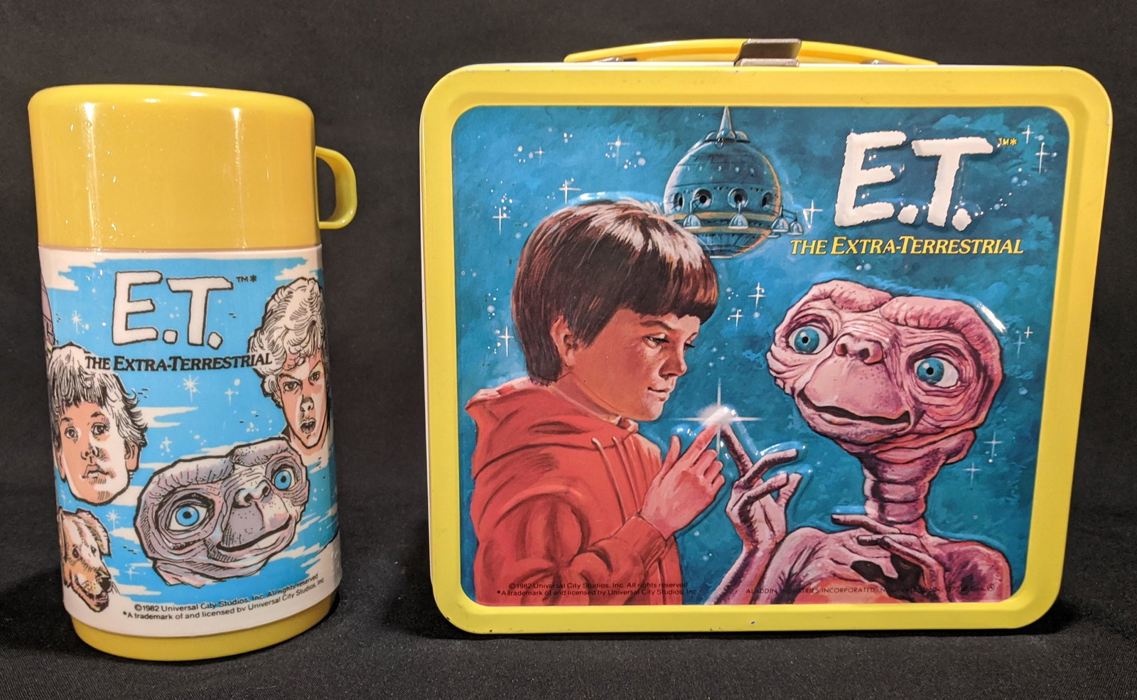1982 Unused E.T. the Extra Terrestrial LUNCHBOX &: This Vintage 1982 E.T. Embossed Metal Lunchbox with Thermos in new unused Minty condition. Features art depicting images from the 1982 Steven Spielberg blockbuster, E.T. The Extra Terrestrial starring