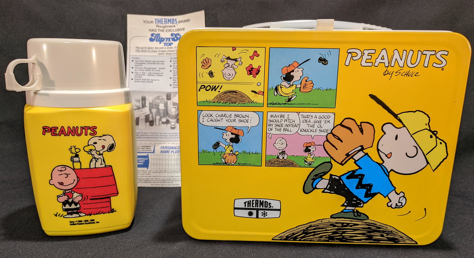 Vintage Metal Peanuts Lunchbox w Thermos Snoopy: This Vintage Metal PEANUTS Lunchbox with thermos and original paperwork is in new unused Minty condition. Complete with Thermos and factory instruction sheet for the “Flip and Sip” lid. Br