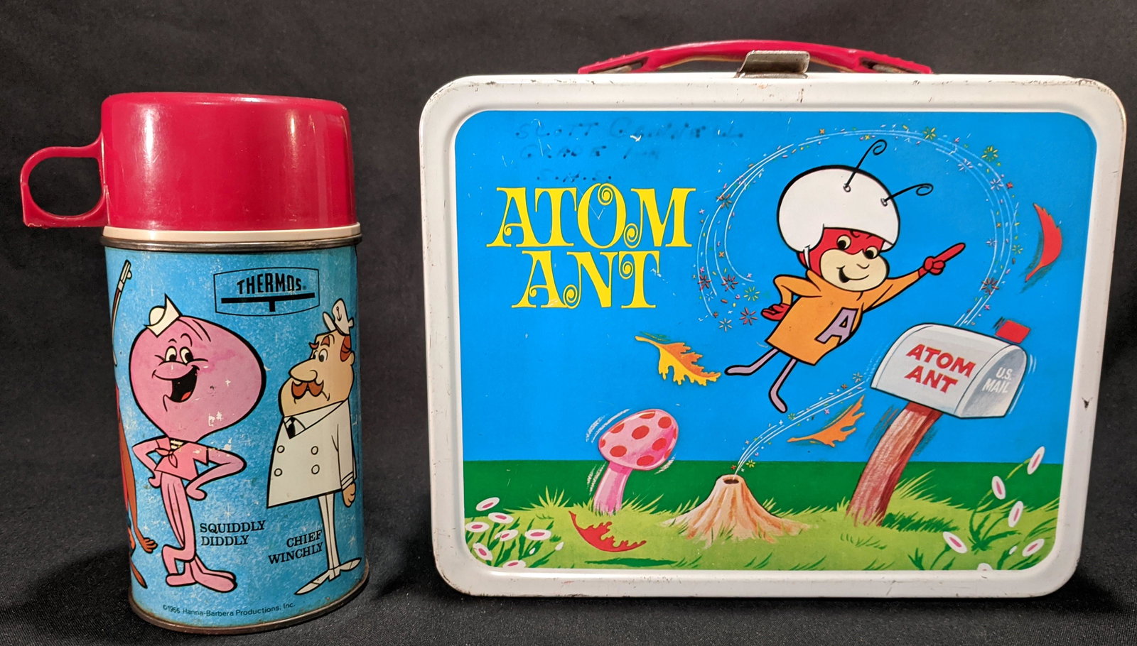 1966 Atom Ant – Secret Squirrel Metal Lunch Box: Vintage Atom Ant – Secret Squirrel Metal Lunch Box and Thermos with great images from the 60’s Hannah Barbera cartoons. Featuring Morocco Mole, Squiddly Diddly and other classic characters