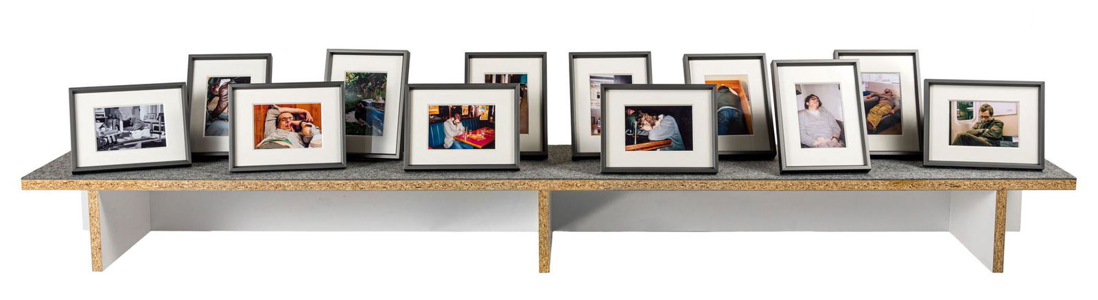 HANS SCHABUS, In search of the endless column (Auf der: HANS SCHABUS (1970) In search of the endless column (Auf der Suche nach der endlosen Saule) 1996-2006 Wooden shelf with 12 framed photographs, ed. 1/5 39 x 187 x 30 cm Signed, dated and titled on the