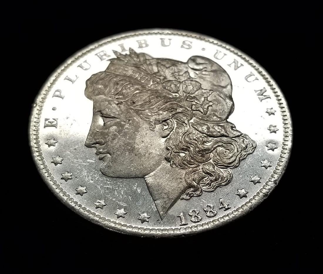 1884- O (NEW ORLEANS) MORGAN SILVER DOLLAR MS63/65 DMPL (1 of 2)