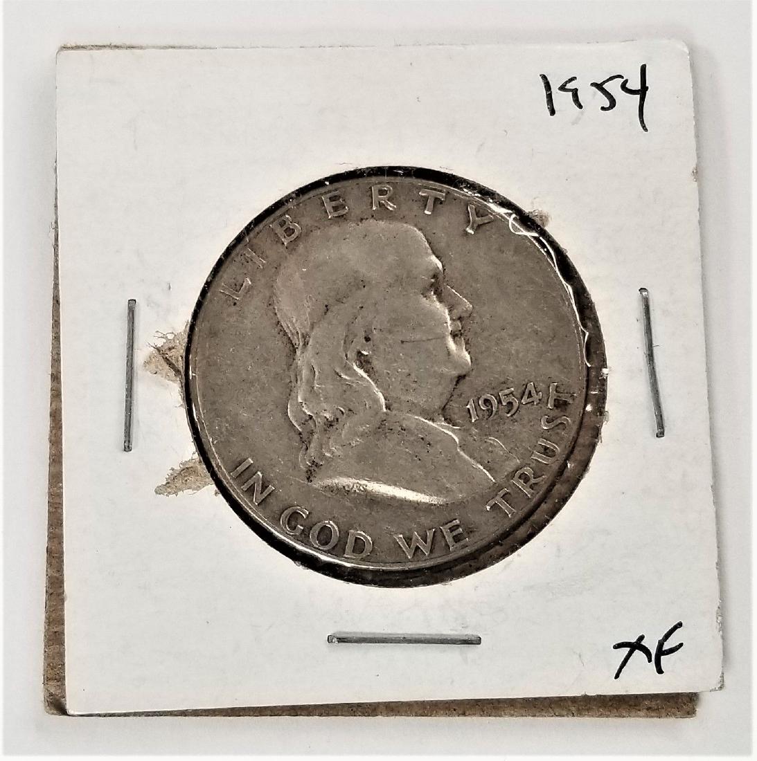 1954-P Benjamin Franklin Half Dollar XF: Winner of this item shall receive the exact items shown. Type: Ben Franklin Half Dollar Year: 1954 Mint Mark: No mint mark Face Value: 0.50 USD Total Produced: 13,188,000