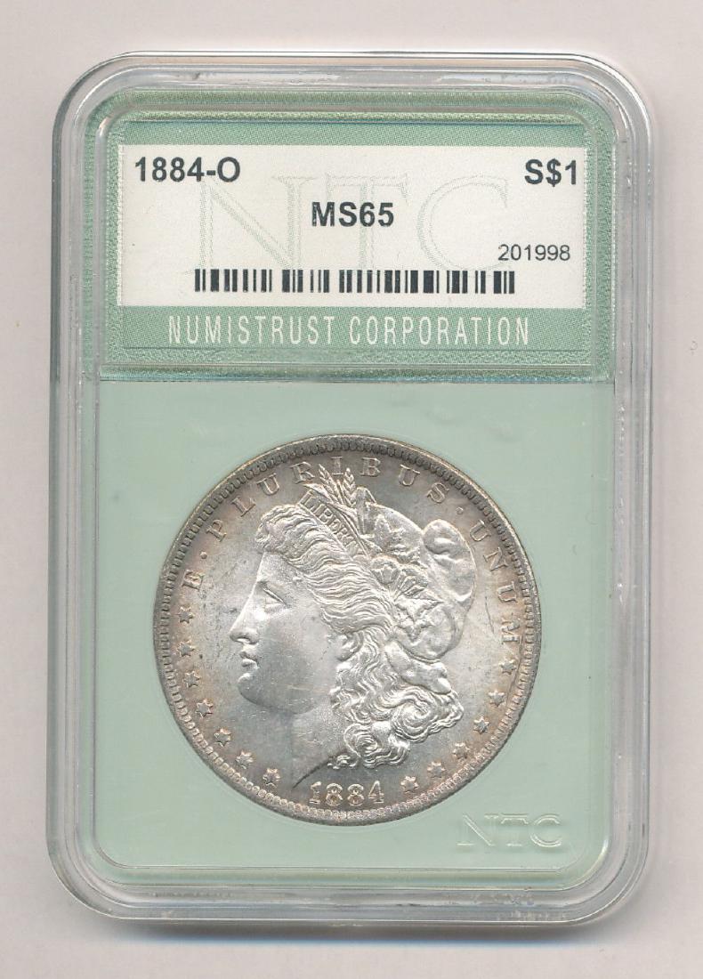 1884-O MORGAN SILVER DOLLAR NTC MS65: MY OLD ACQUAINTANCE GARY STREICH MAY HE REST IN PEACE GRADED THIS COIN IN MY OPINION STRICT BY TODAY'S STANDARDS. I THINK IF YOU BROKE THIS OUT AND YOU SEND IT IN FOR A RE-SUBMISSION TO PCGS OR NGC YO