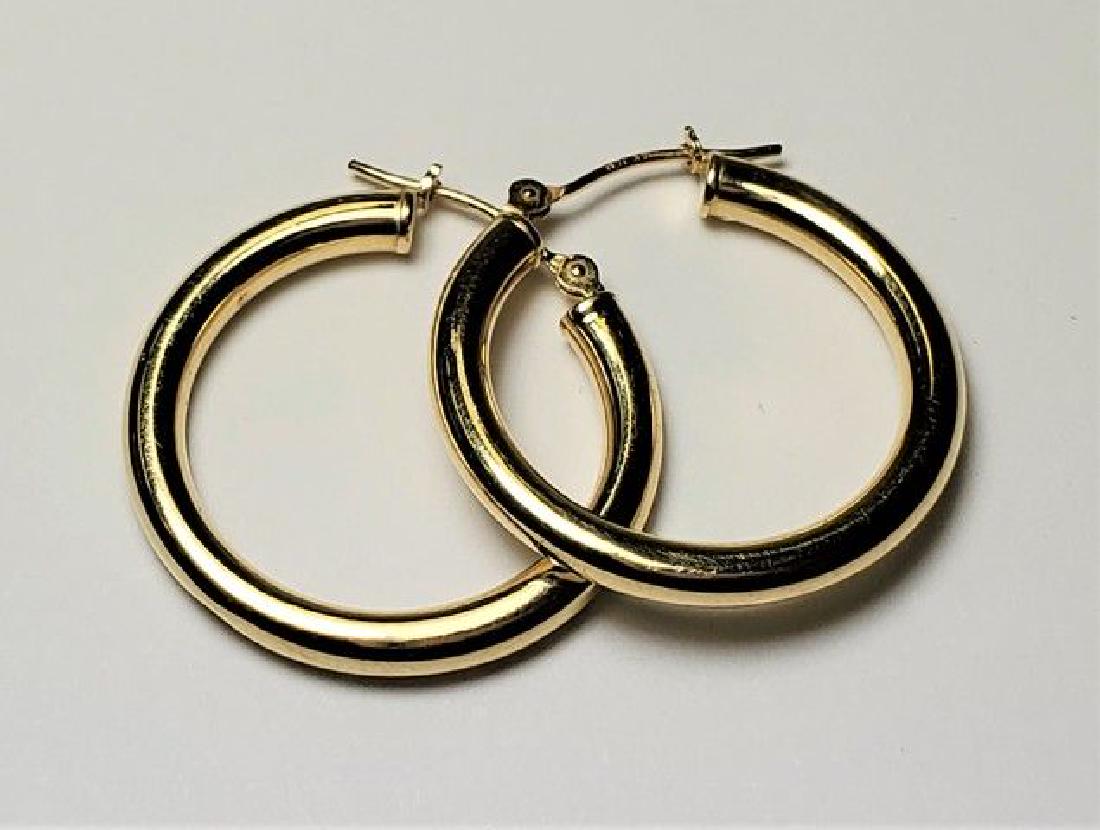 NICE 14K GOLD HOOP EARRINGS WIDTH - 1 INCH: NICE 14K GOLD HOOP EARRINGS WIDTH - 1 INCH - 1.5 GRAMS Stamped (14k) WITH GOLD AT 1340. THIS ITEM HAS A GOLD MELT VALUE OF $40 Winner shall receive exact items shown here.