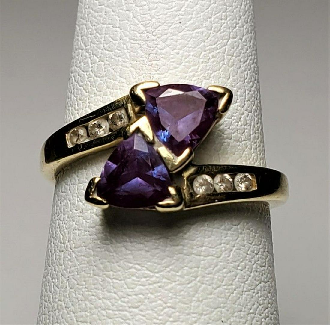 BEAUTIFUL 10K DIAMOND W/ PURPLE STONE GOLD RING: BEAUTIFUL 10K DIAMOND W/ PURPLE STONES GOLD RING. Stamped (10k) 2.5 Grams. SIZE 5 WITH GOLD AT 1390. THIS ITEM HAS A GOLD MELT VALUE OF $50 Winner shall receive exact items shown here.