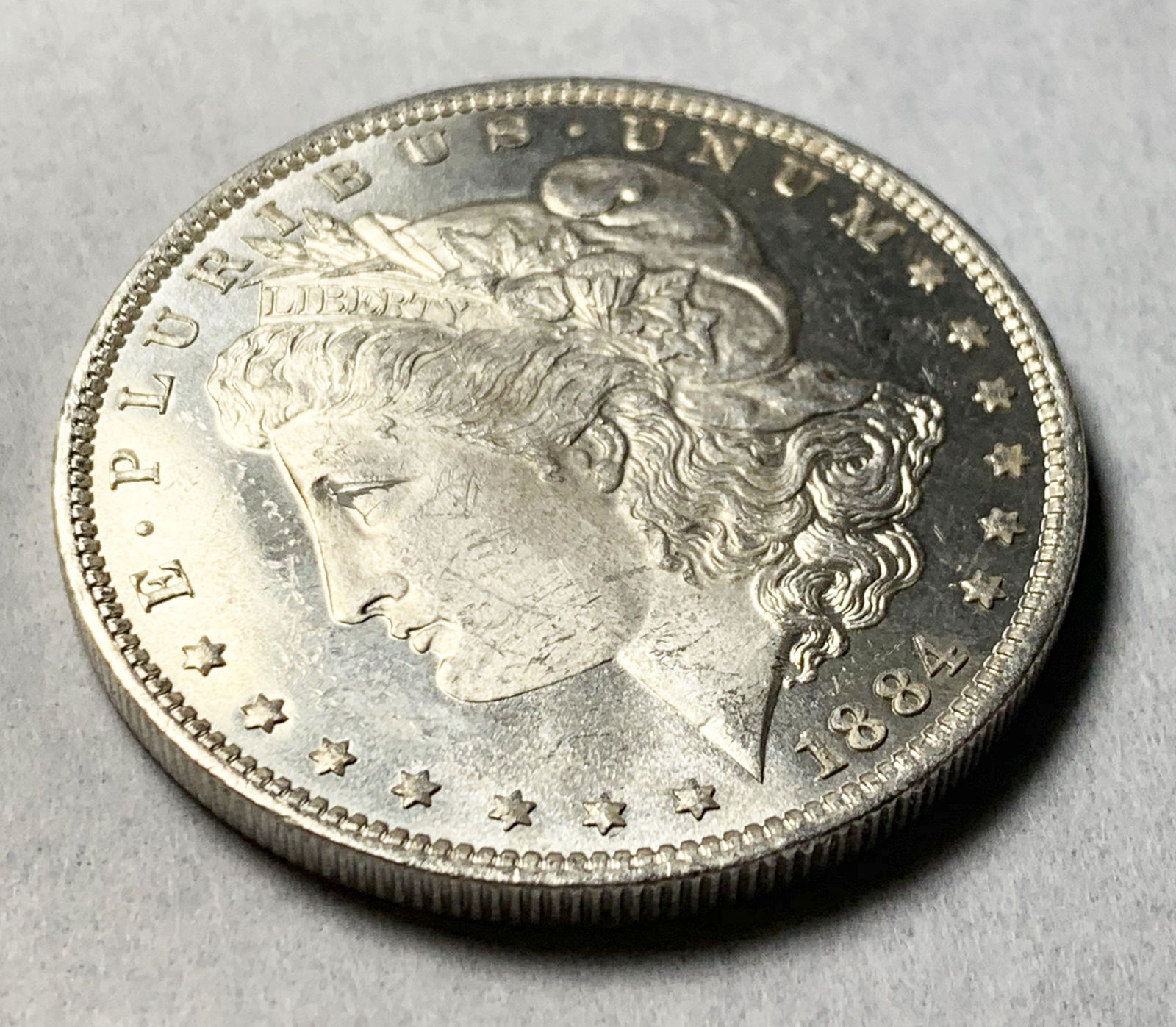 1884-O 65 PL PROOF-LIKE MORGAN SILVER DOLLAR (1 of 2)