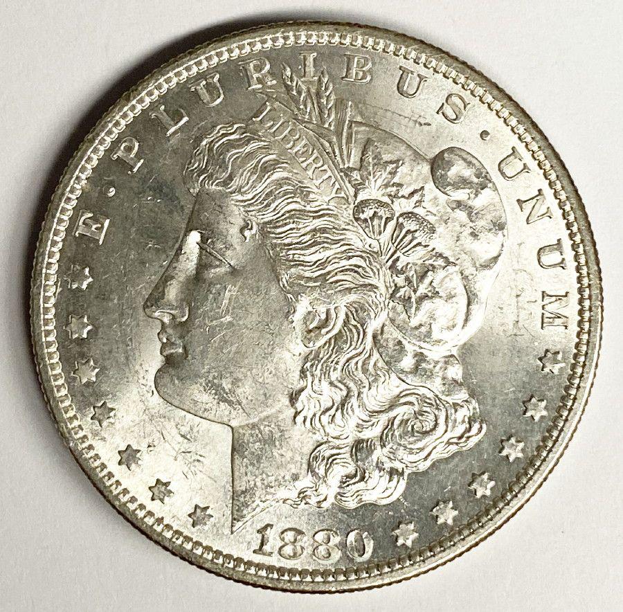 1880-S MORGAN SILVER DOLLAR MS63: 1880-S MORGAN SILVER DOLLAR MS63. WINNER SHALL RECEIVE (1) ONE COIN OUT OF A NEAR COMPLETE SET OF MORGAN SILVER DOLLARS. BY ORDER OF THE CONSIGNOR, THESE COINS ARE TO BE SOLD WITHOUT EVER BEING CERTIF