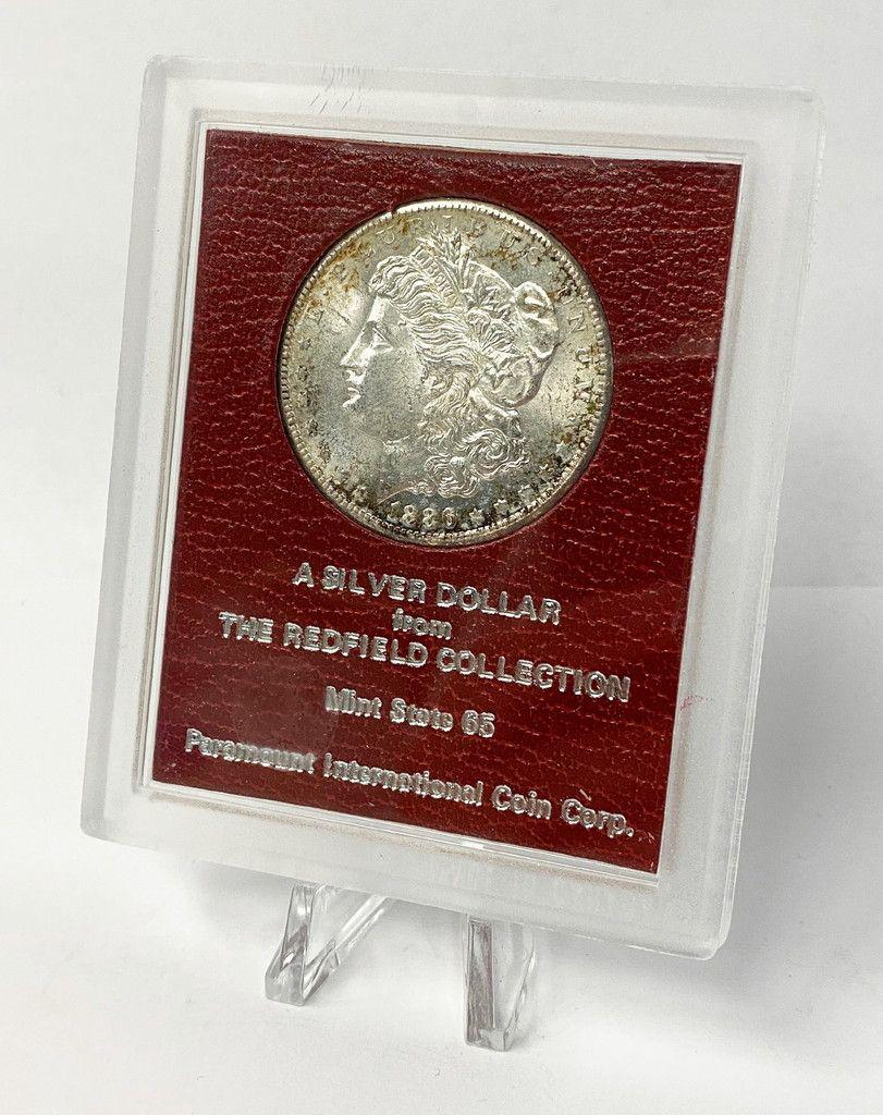 1886-S REDFIELD MORGAN SILVER DOLLAR MS65: SOME OF YOU KNOW THE STORY OF LAVERE REDFIELD. HE WAS A FAIRLY WEALTHY MAN WHO DID NOT TRUST BANKS SO HE BOUGHT BAGS OF SILVER DOLLARS WHICH HE KEPT HIDDEN IN HIS HOME. HE WAS ROBBED SEVERAL TIMES, BU