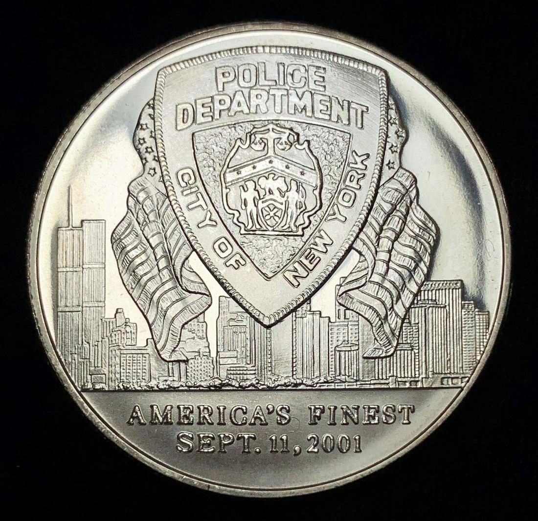 2001 POLICE DEPT CITY OF NEW YORK 1 OZ SILVER (1 of 2)