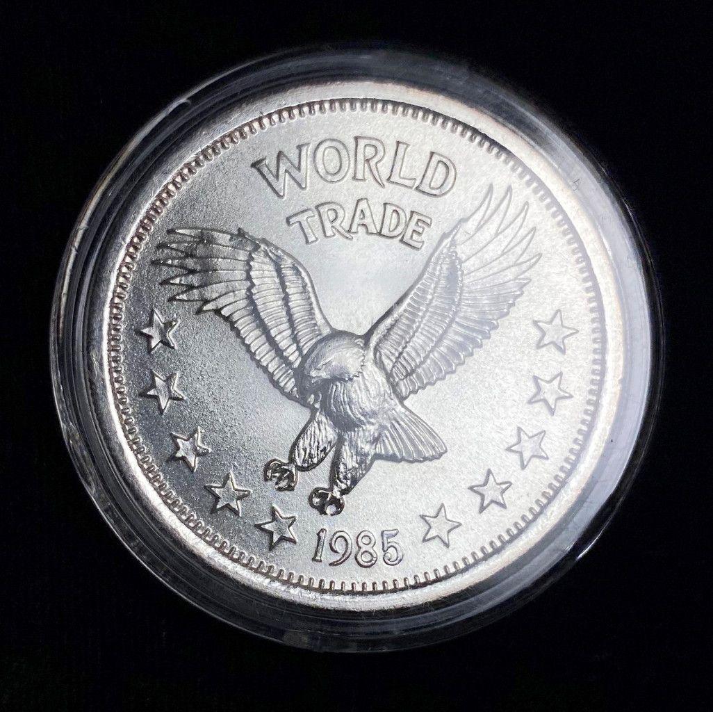 RARE 1985 WORLD TRADE 1 OUNCE .999 SILVER ROUND (1 of 2)