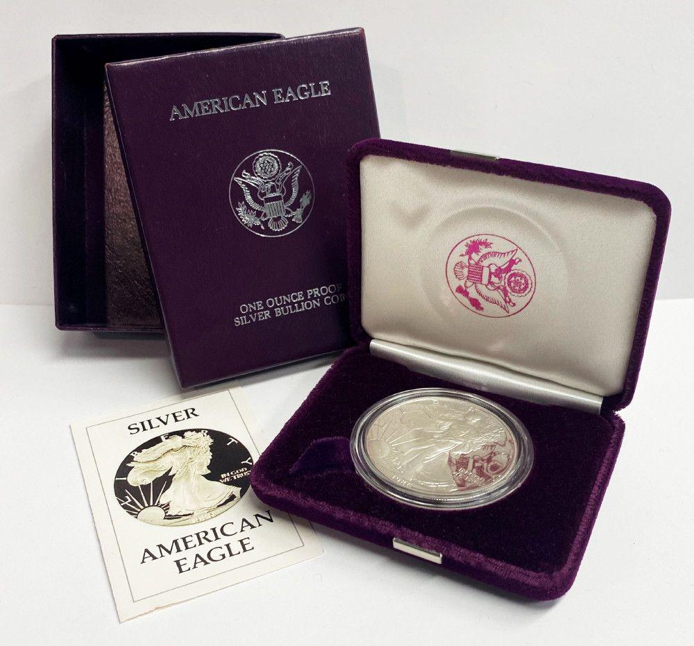 Proof 69 1986 American Silver Eagle OGP: Winner shall receive the exact coin with box and certificate of authenticity shown here.