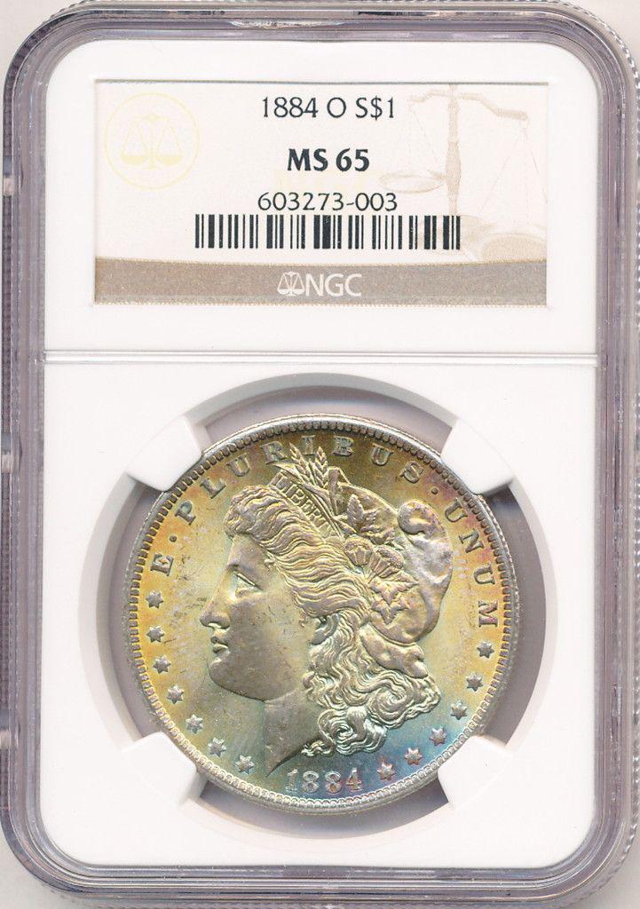 1884-O Beautiful AZ Sunset Tone Morgan Dollar NGC MS65: This is a very special consignment. Our relationship with this client has spanned the length of 3,000 miles and over 25 years! One of the coins from this collection was originally from a sealed GSA bo