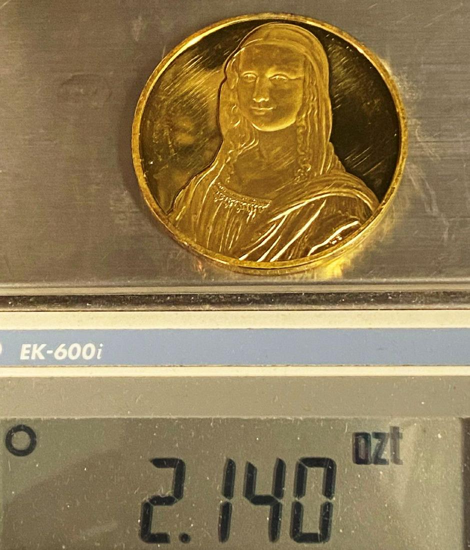 "Mona Lisa" Huge Sterling Golden Silver Medal: This is a silver sterling medal plated with 24 karat gold. The diameter of this coin is measured to be exactly 2 inches.Winner shall receive the exact coin shown here.