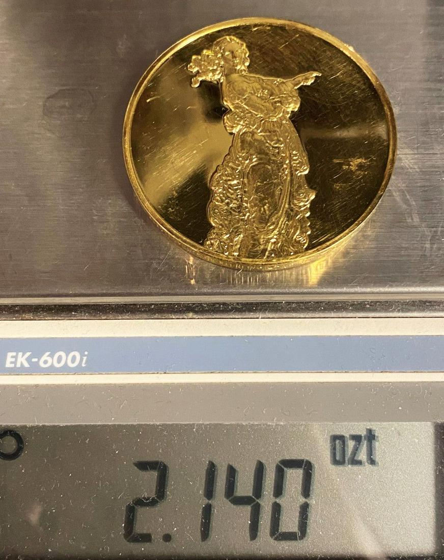"The Pointing Lady" Huge Sterling Golden Silver Medal: This is a silver sterling medal plated with 24 karat gold. The diameter of this coin is measured to be exactly 2 inches.Winner shall receive the exact coin shown here.