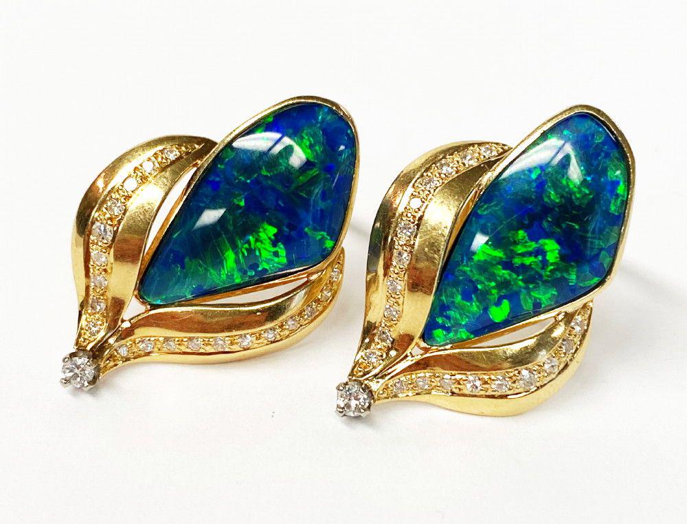 Vintage 18k Gold Earrings w/ Boulder Opals And Diamonds: This set of (2) earrings contain 2 boulder opals, 2 (1/16 carat) diamonds, and an additional 40 very tiny diamonds total. The weight is 12 grams and dimensions are 20mm X 30mm. Winner shall receive th
