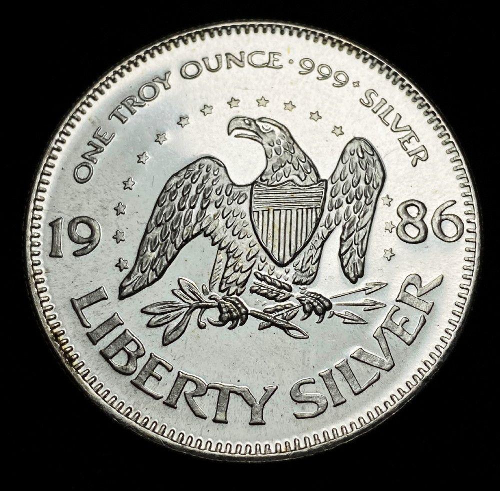 1986 Hoffman Liberty Flying Eagle 1oz Silver: Winner shall receive the exact coin shown here. (EM/UB)