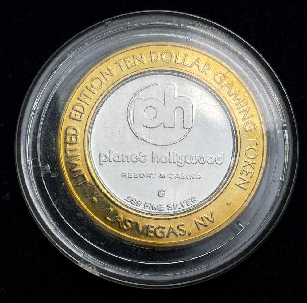 Rare Collectable "PH" .999 Fine Silver $10 Gaming Coin: Rare Collectable "Planet Hollywood" .999 Fine Silver $10 Gaming CoinWinner shall receive the exact coin shown here. (EM/LB)