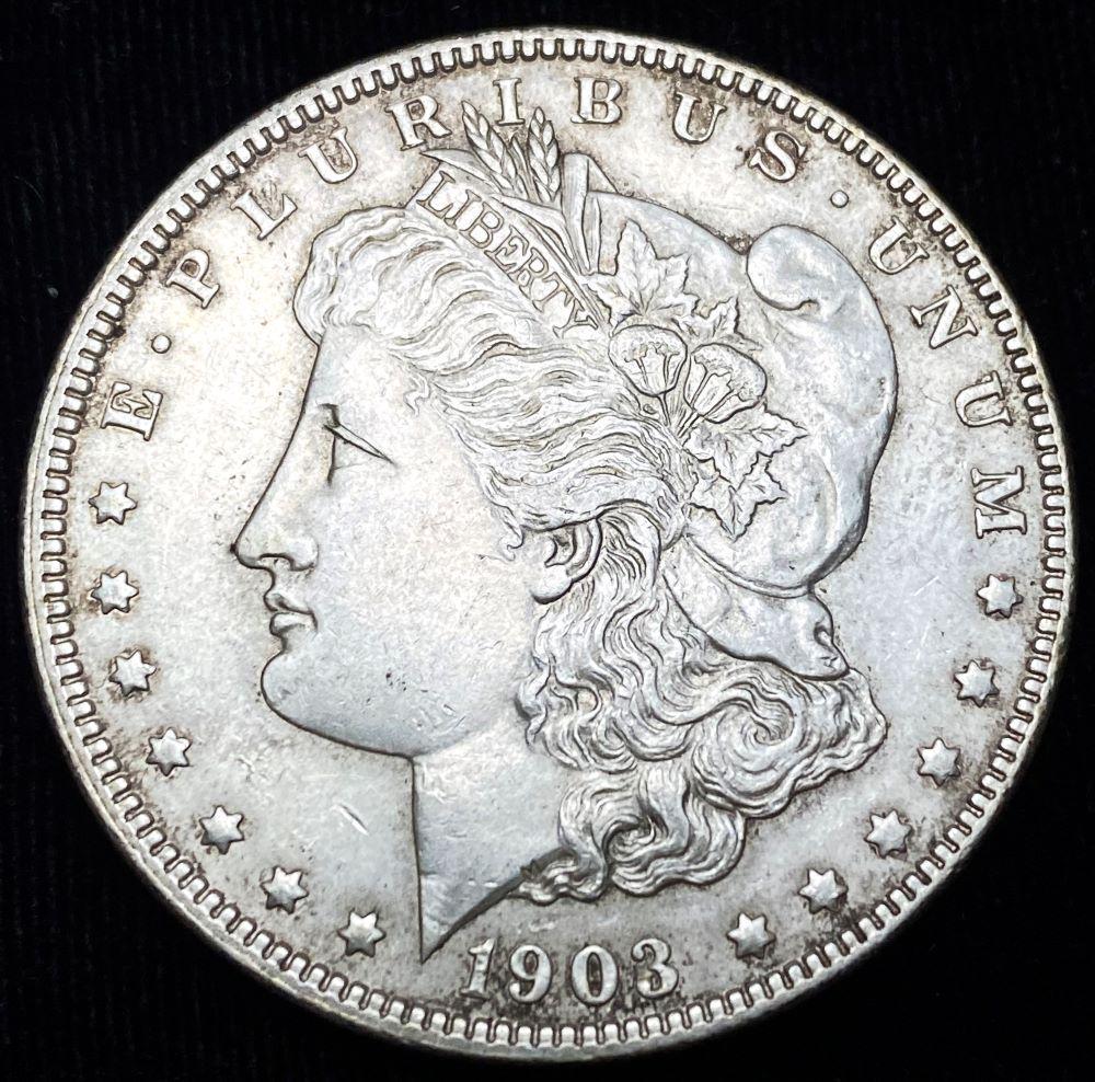 Original 1903 Morgan Silver Dollar AU: This coin was placed into these books back around the 1970's, when they had been collected as a nearly complete set. We are selling all of the coins as individual lots, in the condition they have been