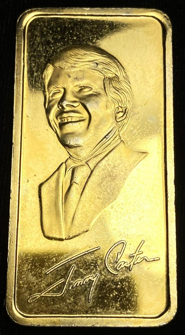 James E. Carter 1 ozt 24K Gold Plated .999 Silver Bar: James E. Carter The Hamilton Mint 1 ozt 24K Gold Plated .999 Silver Bar Winner shall receive the exact bar shown here. (RR/TVC=UU)