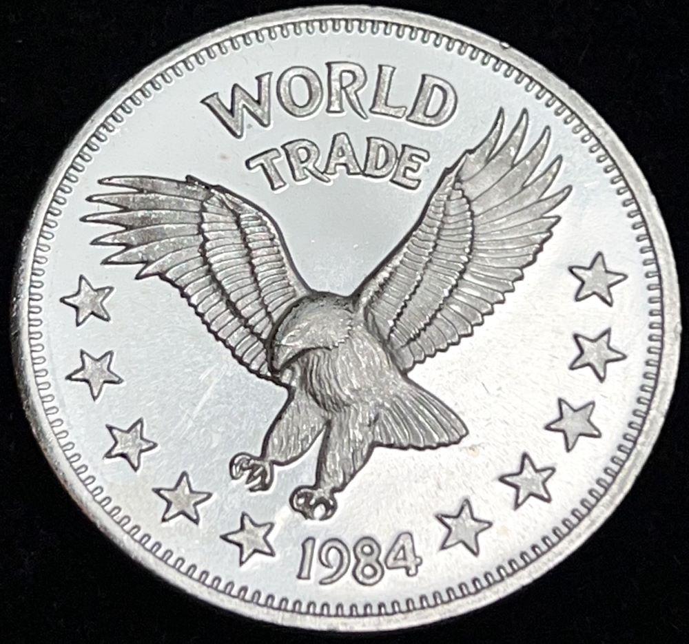 1984 One World Trade Unit Silver Proof 1 ozt .999: Winner shall receive (1) coin precisely resembling the coin shown here. (EP/B)