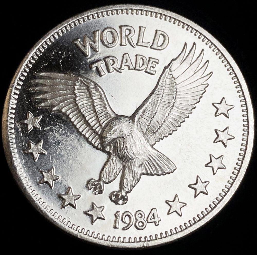 1984 Proof One World Trade 1 ozt .999 Silver: Winner shall receive the exact coin shown here. (RR/B)