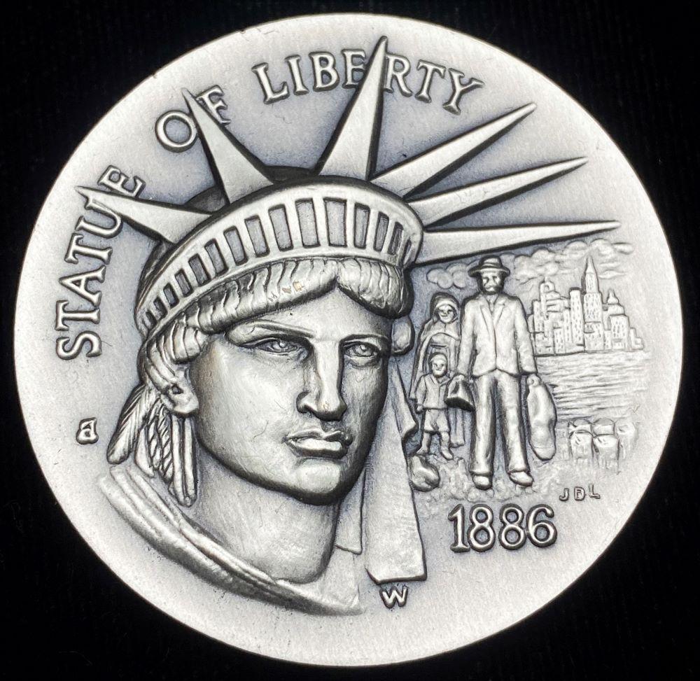 1886 "Statue Of Liberty" Longines Symphonette Sterling Silver: Winner shall receive the exact coin shown here. (RR/B)