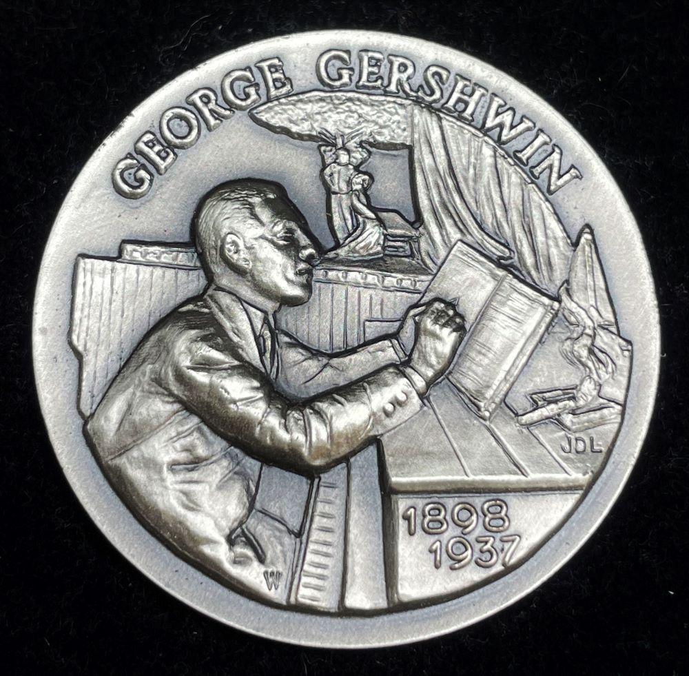 1898-1937 "George Gershwin" Longines Symphonette Sterling Silver: Winner shall receive the exact coin shown here. (JM/B)