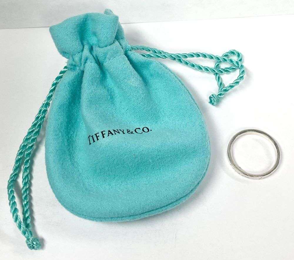 Tiffany & Co. "I Love You" Ring .925 Sterling Silver: This ring is a size 8.Winner shall receive the exact item shown here. (RR)