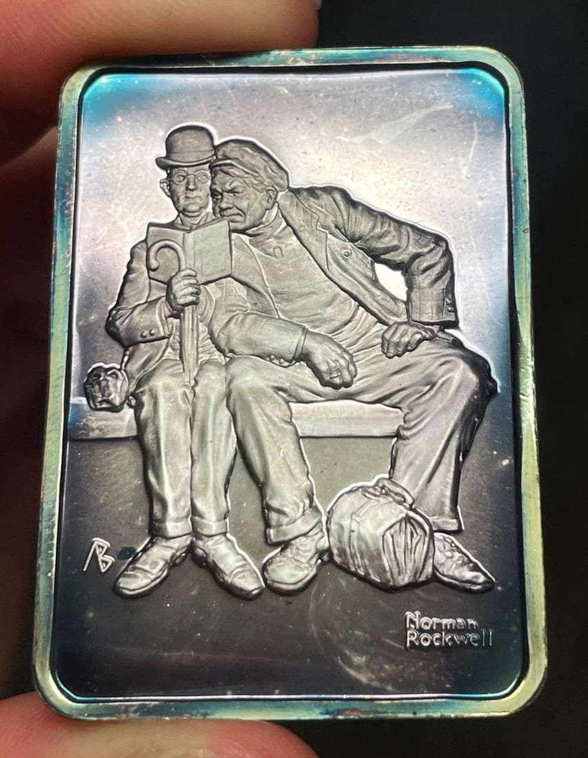 Spot Light Rainbow Toning "At the Depot" 1927 Norman Rockwell 1 Ozt .999 Silver Bar: Winner shall receive the exact bar shown here. (JM/B)