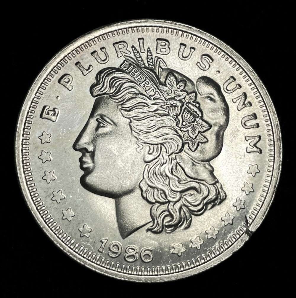 1986 Morgan Dollar Design 1 ozt .999 Silver Trade Unit: Winner shall receive the exact coin shown here. (JM/B)