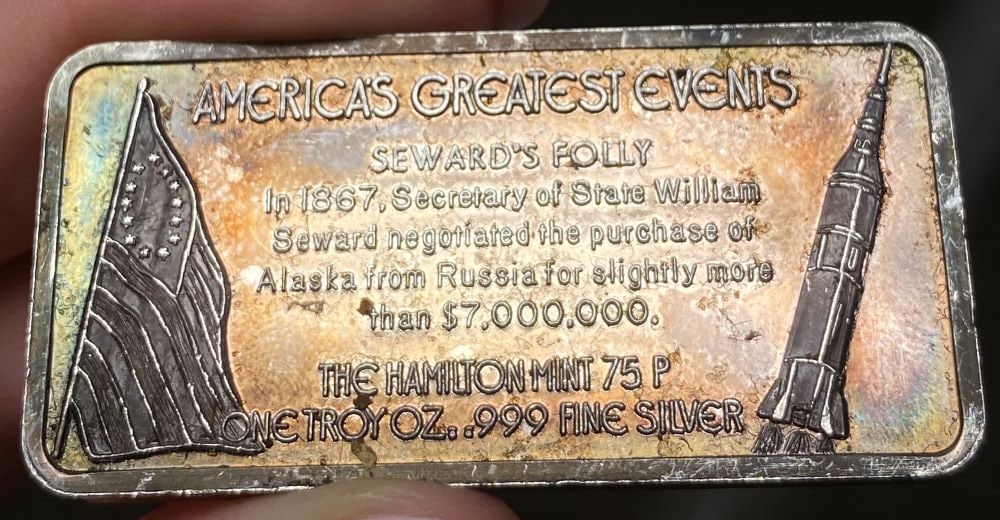 Toned Hamilton Mint "Alaskan Purchase" 1 ozt .999 Silver Bar: Winner shall receive the exact bar shown here. (EP/B)