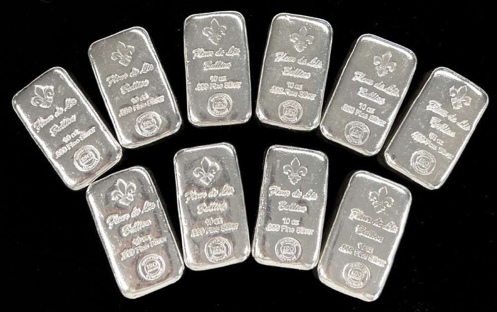 (10) 10 ozt .999 Fine Silver Fleur De Lis Bullion Bars: This item comes from our consignors vault in St. Louis. Please allow 2-4 weeks for delivery. Winner shall receive TEN (10) 10 ozt .999 silver bars, precisely resembling the bars shown here.