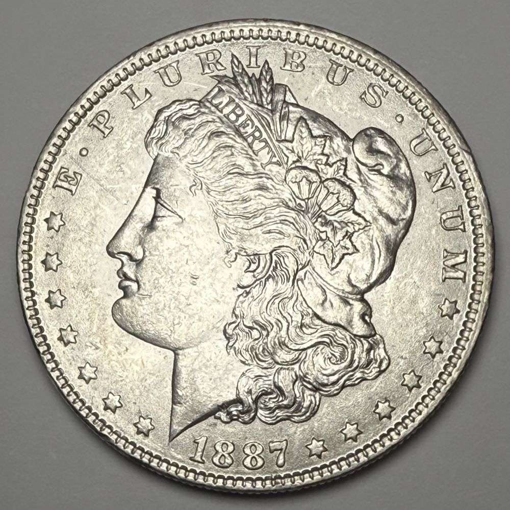 1887-O Morgan Silver Dollar MS63: Winner shall receive the exact coin shown here. (CD/B)