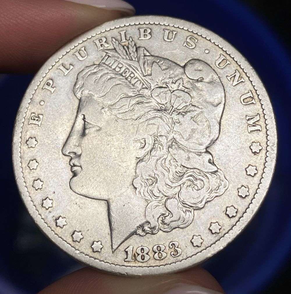 1883-CC Morgan Silver Dollar VF: Winner shall receive the exact coin shown here. (RR/B)