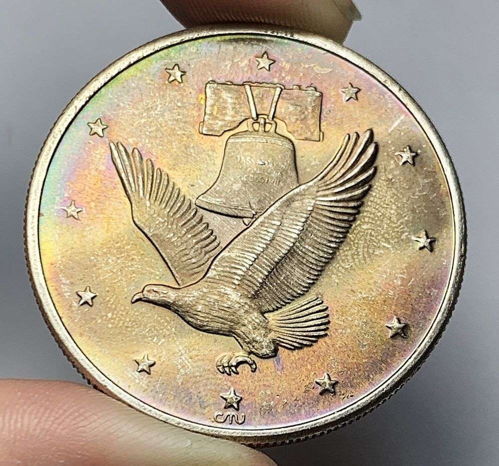 Toned Eagle Bell 1 ozt .999 Silver: Winner shall receive the exact coin shown here. (HN/B)
