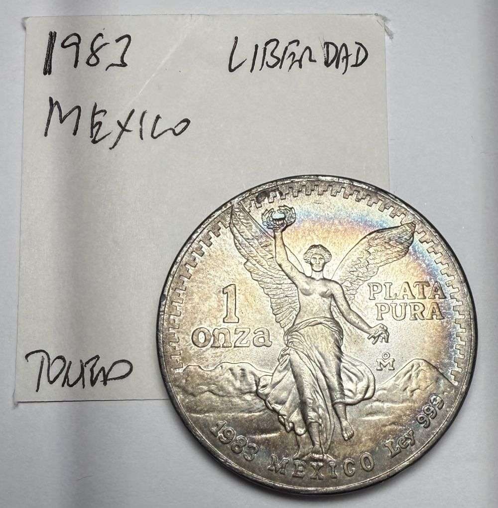 Toned 1983 Mexican Libertad 1 ozt .999 Silver: Winner shall receive the exact coin shown here. (CD/B)