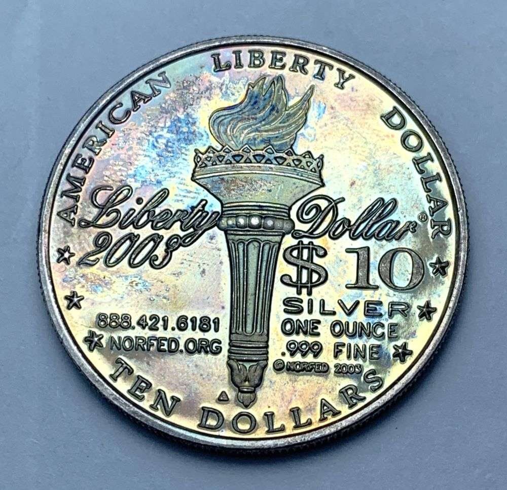 Toned 2003 Liberty $10 Design Proof 1 ozt .999 Silver: Winner shall receive the exact coin shown here. (BD/B)