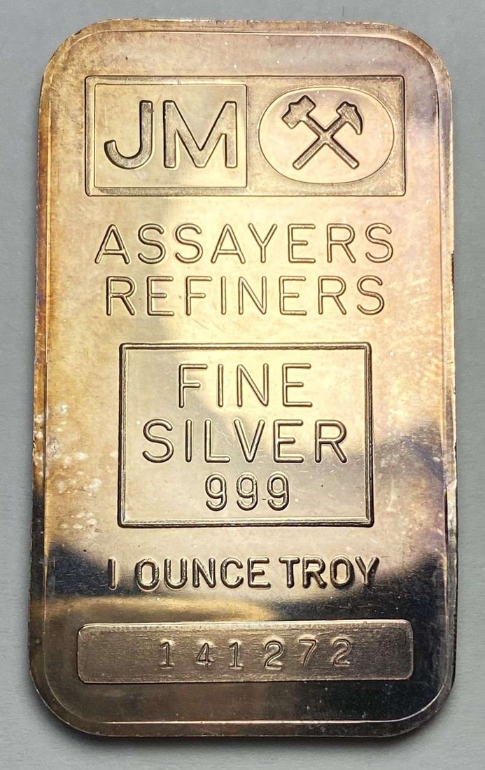 Toned JM Assayers & Refiners 1 ozt .999 Silver Bar: Winner shall receive the exact bar shown here. (RR)